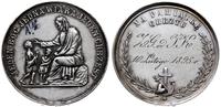 medal chrzcielny z 1895 r., Aw: Siedzący na skal