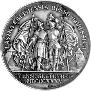 medal autorstwa L. Helda wybity z okazji manewrów rosyjsko-pruskich w Kaliszu w 1835 r., Aw: Popiersia Mikołaja I i Fryderyka Wilhelma III w lewo i napis w otoku, u dołu sygn. L. HELD F., Rw: Dwaj wojownicy ze sztandarami na tle obozu wojskowego i napis w otoku: CASTRO CALISIENSIA RUSSO-BORUSSICA, w odcinku: MENSE SEPTEMBRE MDCCCXXXV, H-Cz.10416, Henckel 2063, srebro 33,5 mm, 12,25 g., patyna
