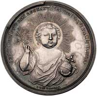 medal bożonarodzeniowy autorstwa J. L. Oexleina 1745 r., Aw: Chrystus leżący w żłobku, po bokach a..