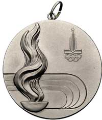 medal nagrodowy Igrzysk XXI Olimpiady, Moskwa 1980, Aw: Siedząca kobieta z gałązką wawrzynu w ręku..