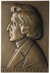 Fryderyk Chopin - plakieta autorstwa J. Aumillera 1927r.; Popiersie w lewo i napis FRYDERYK CHOPIN..