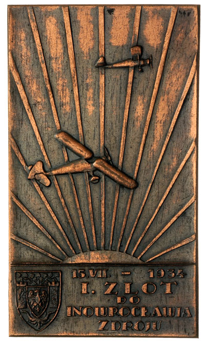 15.VII - 1934 I Zlot do Inowrocławia Zdroju, plakieta niesygnowana, Dwa samoloty na tle promieni słonecznych, poniżej herb Inowrocławia i napis, brąz 47 x 82 mm