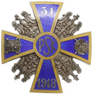 oficerska odznaka pamiątkowa 31 Pułku Strzelców Kaniowskich - Sieradz, trzyczęściowa w kształcie krzyża równoramiennego pokrytego niebieską emalią z żółtym obramowaniem. W środku inicjał PSK, na pionowych ramionach krzyża numer pułku 31 i rok powstania 1918 na poziomych ramionach srebrny herb Kujaw i odznaka 2 Korpusu, między ramionami krzyża srebrne Orły Jagiellońskie. Na stronie odwrotnej inicjały wytwórcy B.G.(Bronisław Grabski), nakrętka sygnowana BR.GRABSKI ŁÓDŹ, 2 nity posiłkowe, srebro 41 x 41 mm, Sawicki/Wielechowski s. 63, bardzo ładny egzemplarz
