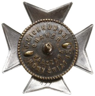 odznaka Naczelnego Dowództwa Wojska Polskiego Sztab Generalny, wytłoczony z cienkiej blachy krzyż równoramienny pokryty granatową emalią. Na ramiona nałożony pierścień wypełniony liśćmi laurowymi. Na pierścieniu napis NACZ-DOW-WP-SZT-GEN-1918-1921, w polu orzeł wsparty na skrzyżowanych buławach. Odznaka dwuczęściowa, łączona czterema drutami, srebro 40.5 x 40.5 mm, na stronie odwrotnej nr 199, nakrętka sygnowana J.Michrowski, Sawicki/Wielechowski s. 626, bardzo rzadka
