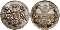medal zaślubinowy 1900, Aw: Dwa putta trzymające