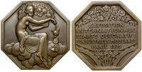 medal pamiątkowy 1928, Aw: Kobieta siedząca w ch